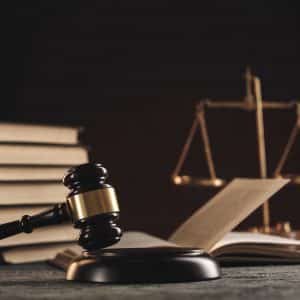 law concept open law book with wooden judges gavel table courtroom law enforcement office black background kopiya x