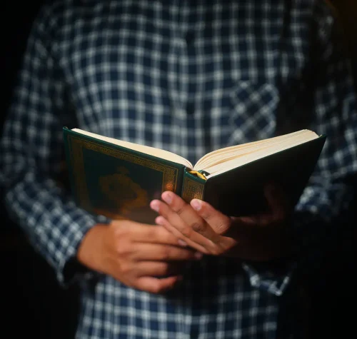 muslim man reading holy koran x