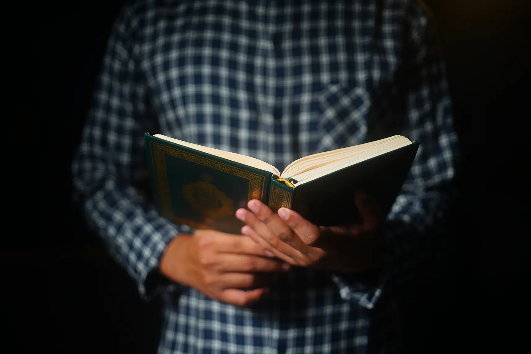 muslim man reading holy koran